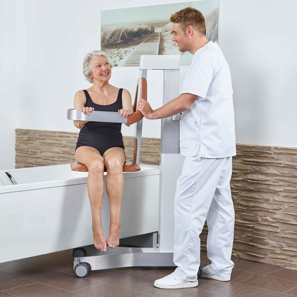 beka eve bath and shower lift patient with caregiver 600x600
