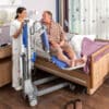 beka senta pur l bath and shower lift patient on senta extended with caregiver 1 600x600