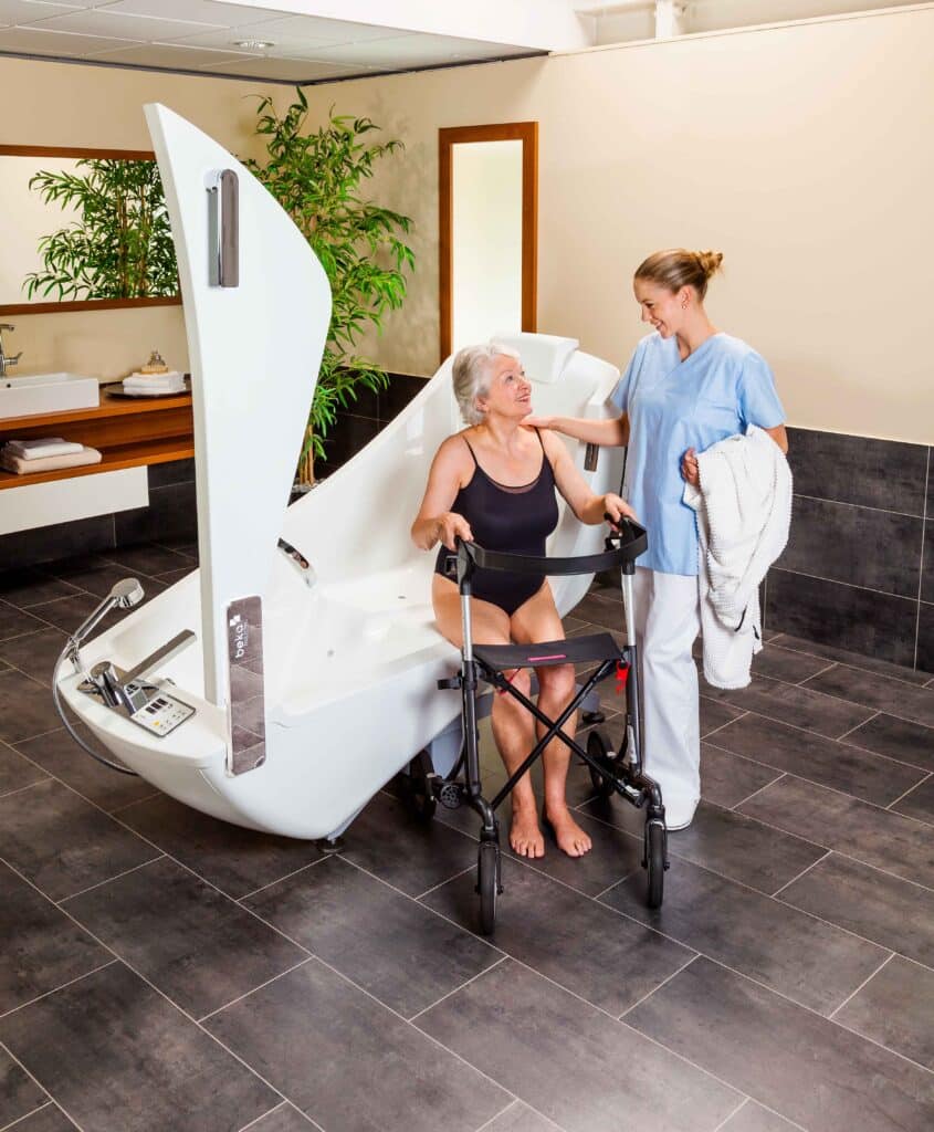 beka averno motion bath tub open door with patient and caregiver